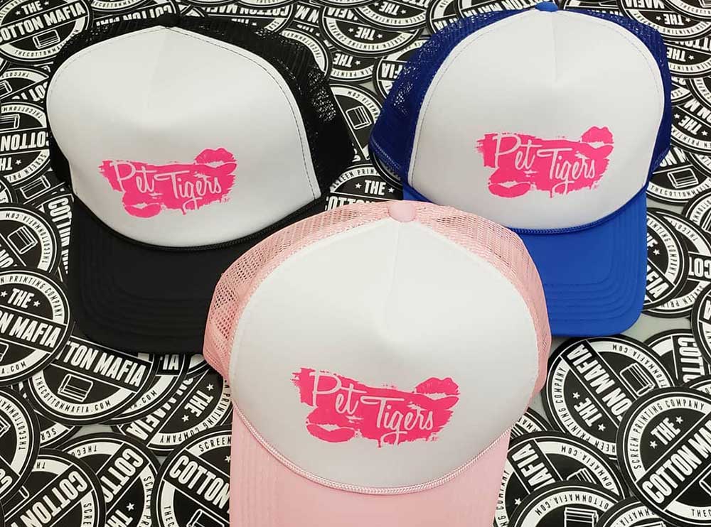 custom screen printed trucker hats and vinyl stickers